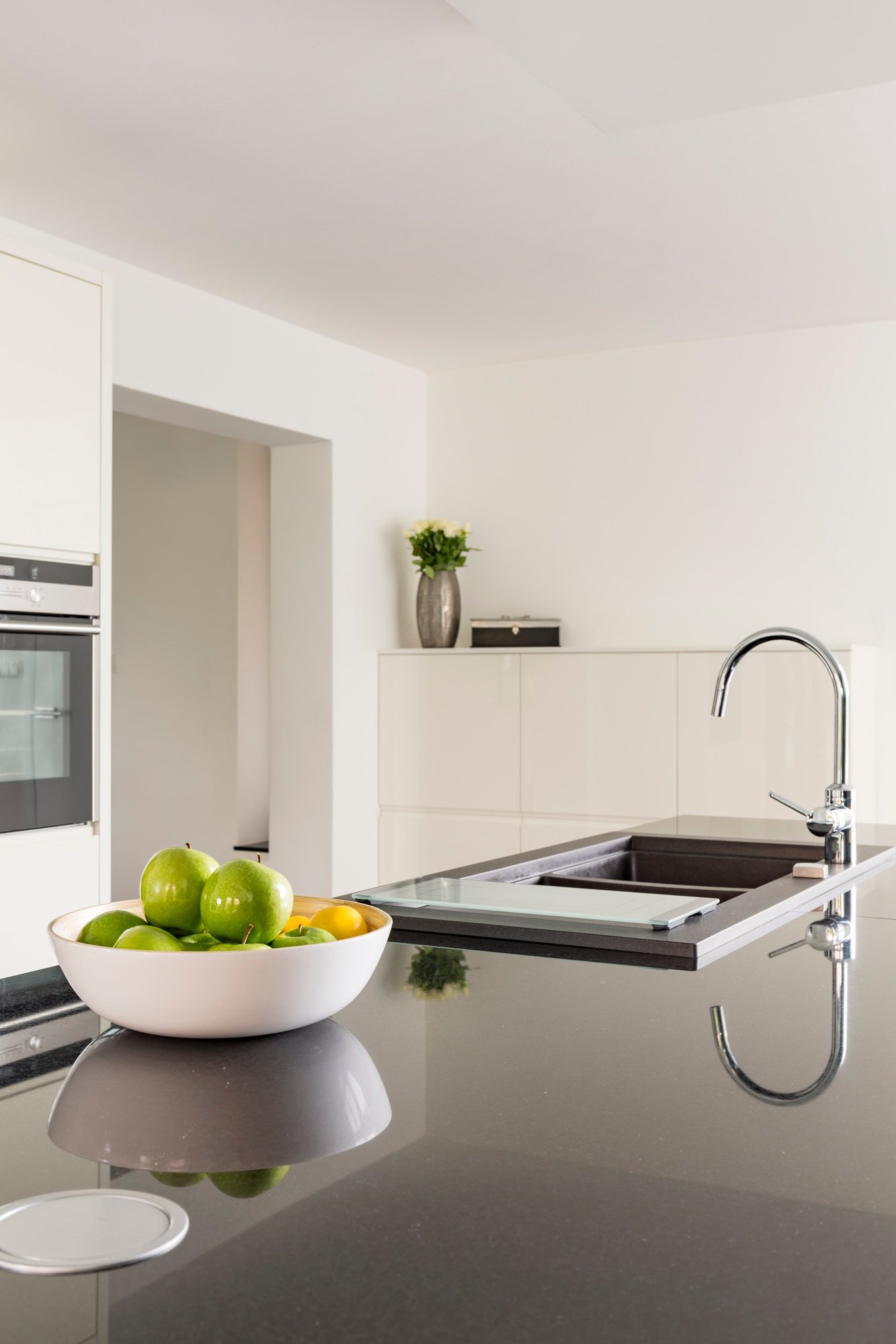 White kitchen with black worktop